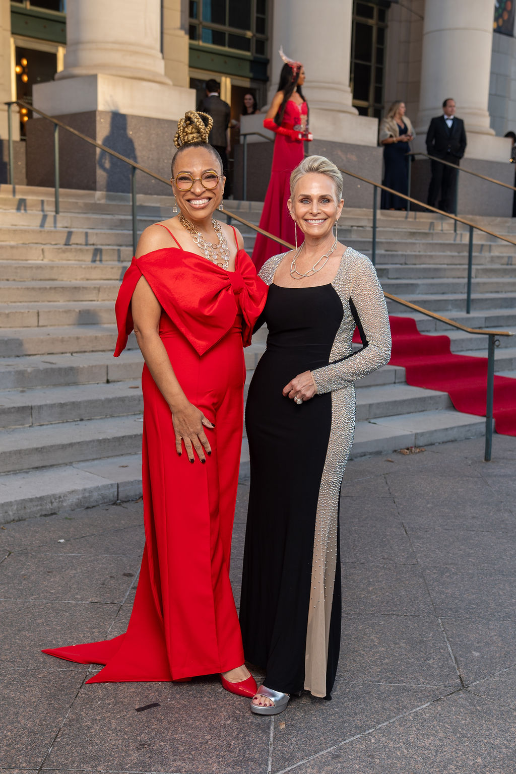 Two women in evening gowns on the Schermerhorn steps at the 2025 NEXT Awards