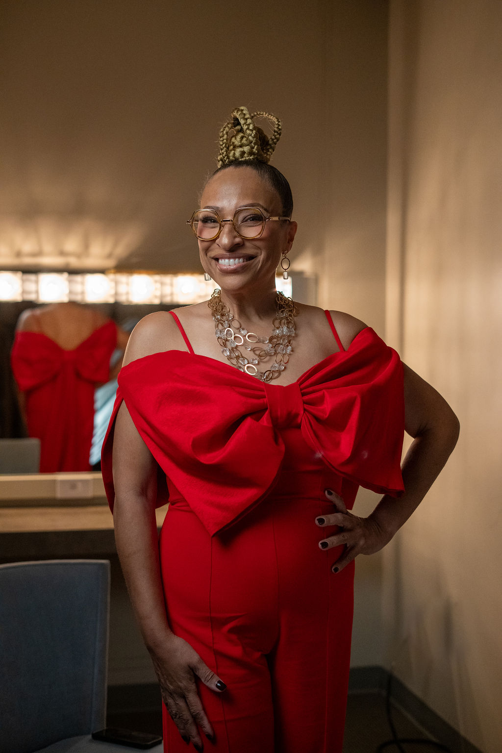 Mignon Francois, Freeman Award winner, striking backstage portrait in red