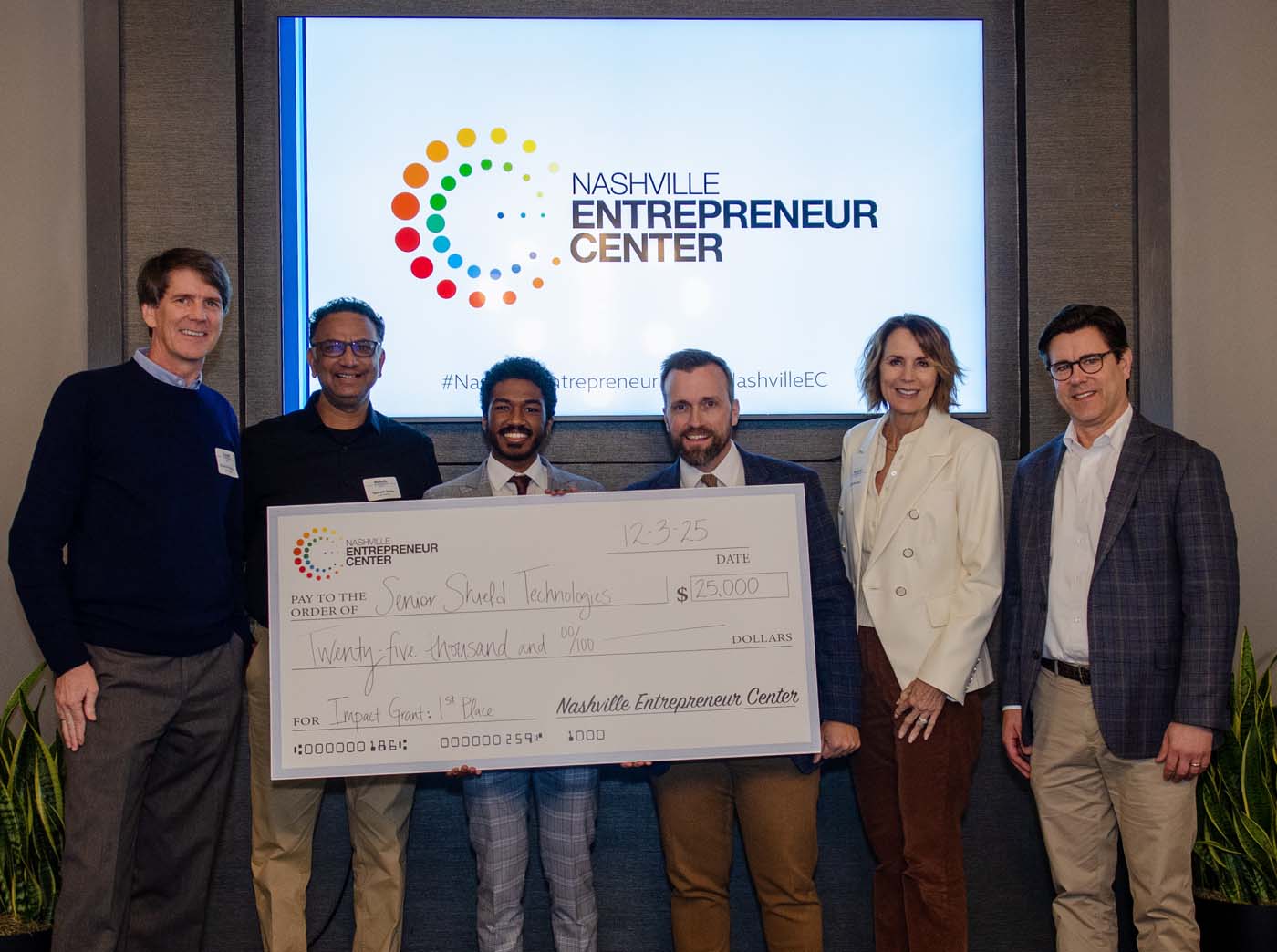 Senior Shield Technologies receiving the $25,000 Impact Grant — Project Healthcare graduate