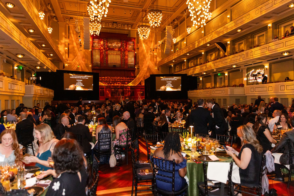 Wide shot of guests in formal wear filling the Schermerhorn Symphony Center at the 2025 NEXT Awards