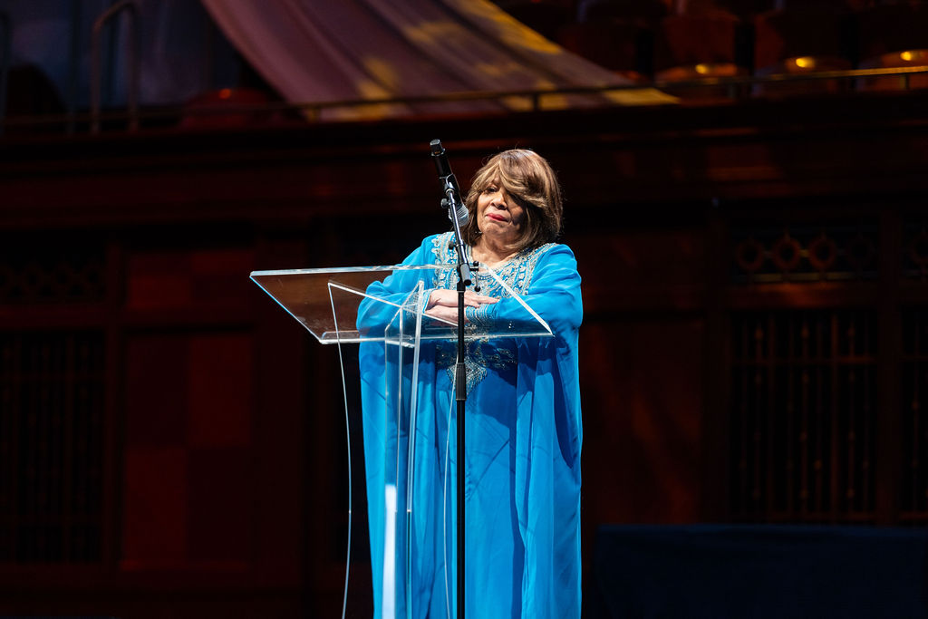 Speaker on stage at the Schermerhorn