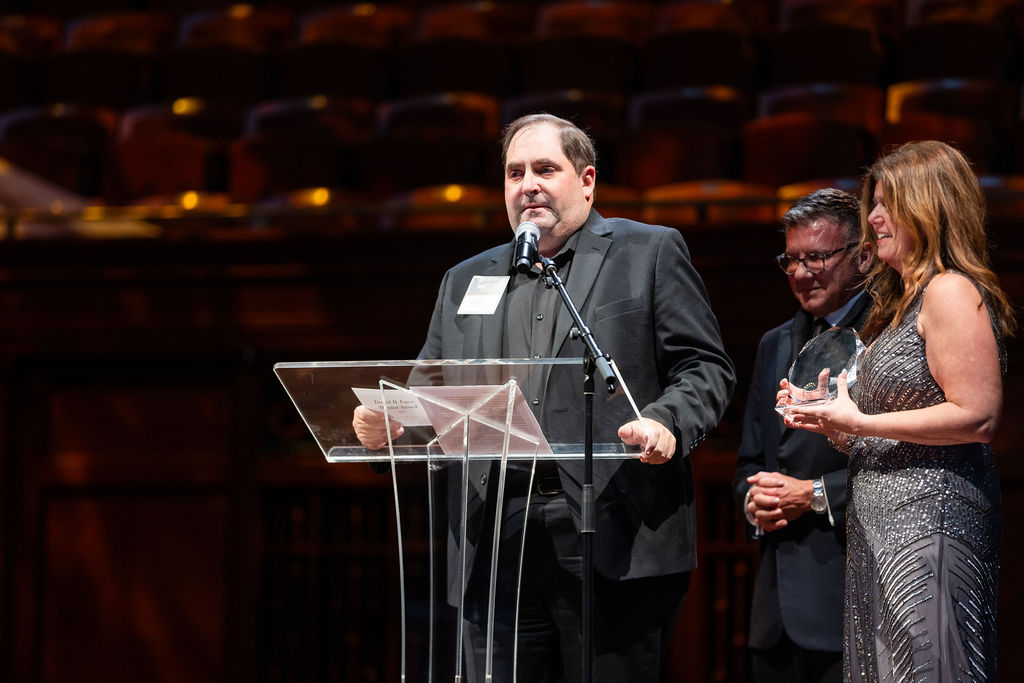 Speaker at the podium during the 2025 NEXT Awards ceremony