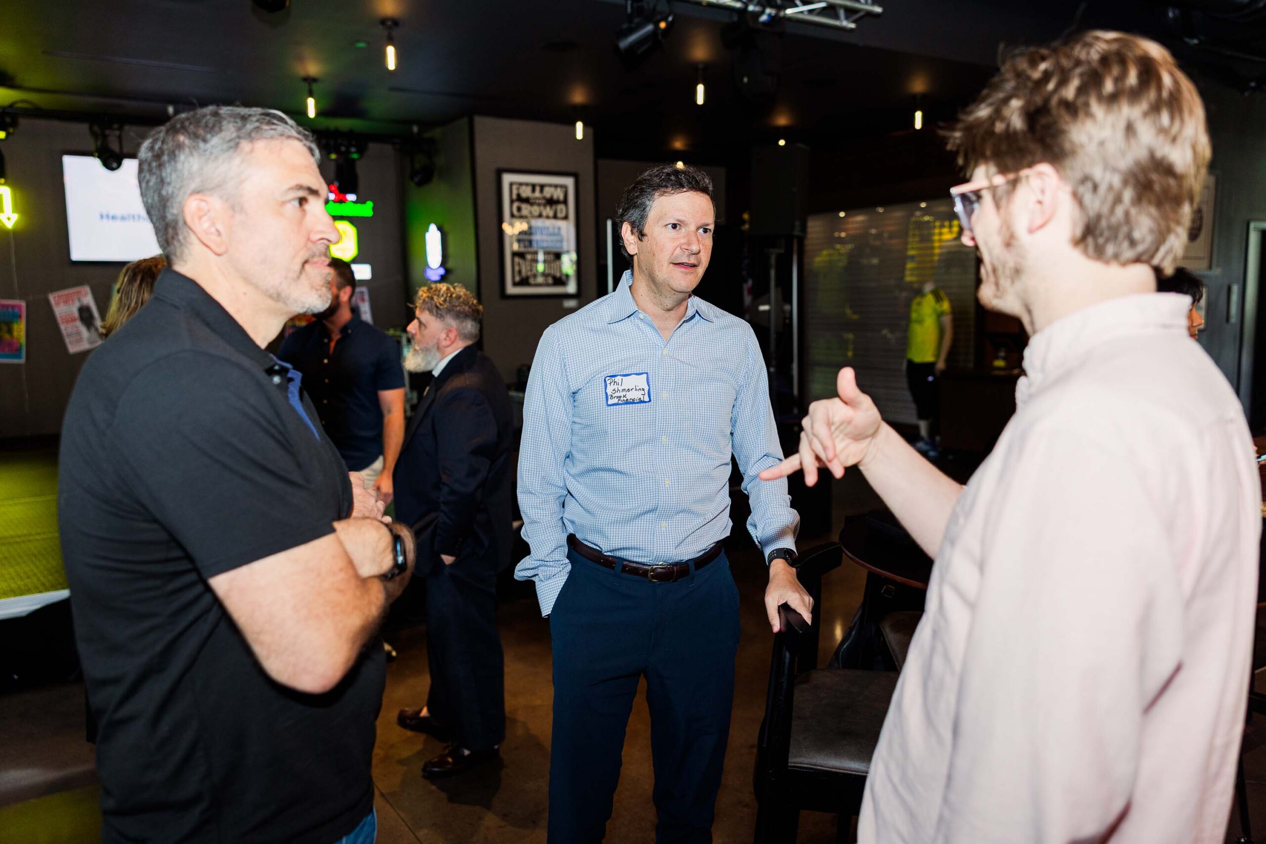 Founder talking with a connector after their pitch