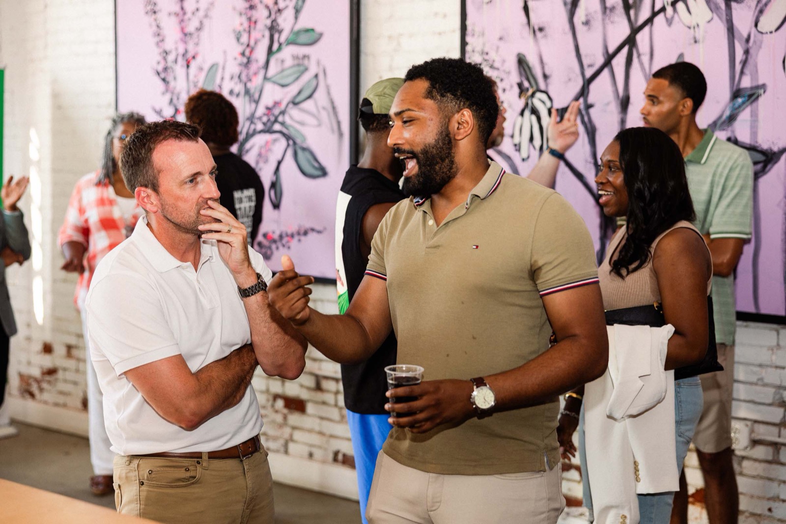 Founders laughing together at a Founders Circles happy hour