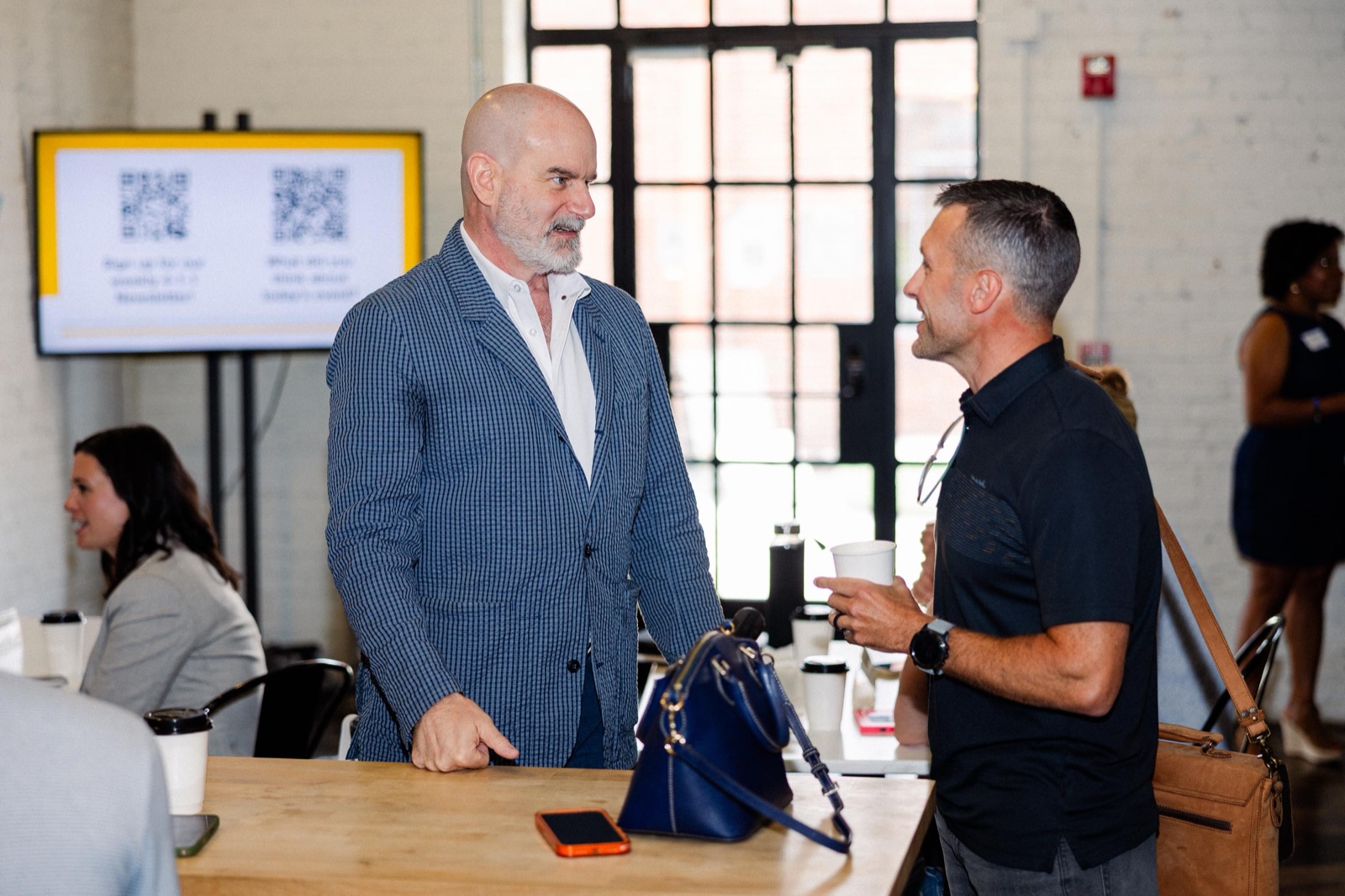 An entrepreneur-in-residence in conversation with a founder across a table at the EC