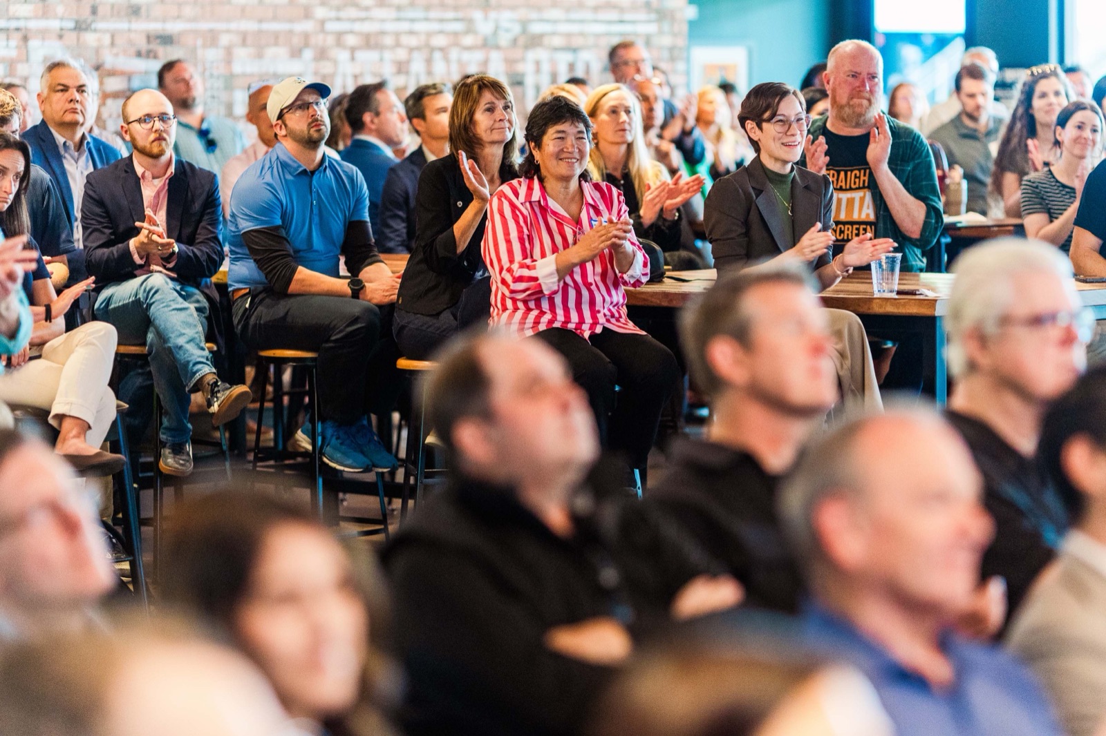 Seated attendees applauding during a pitch at Nashville Entrepreneur Day