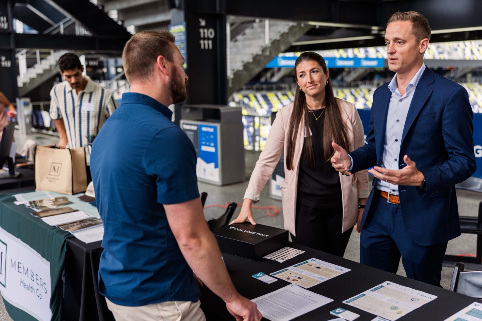 Founders in conversation at an expo booth at Nashville Entrepreneur Day