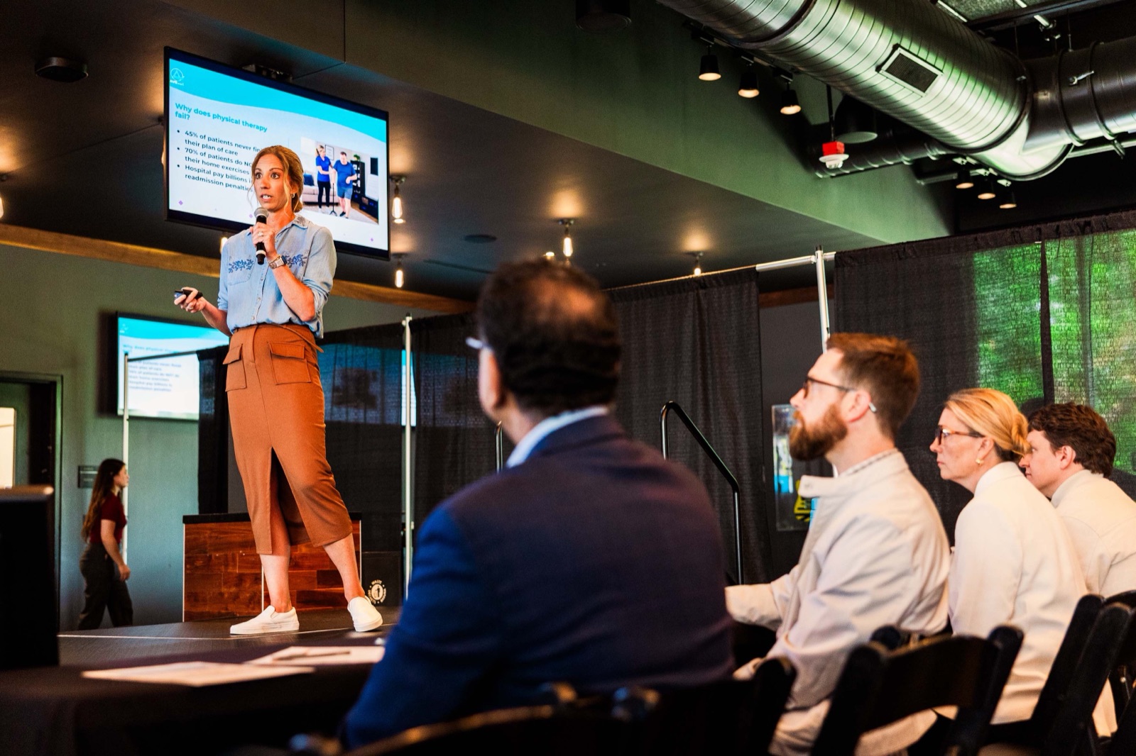A founder pitching on stage at Nashville Entrepreneur Day